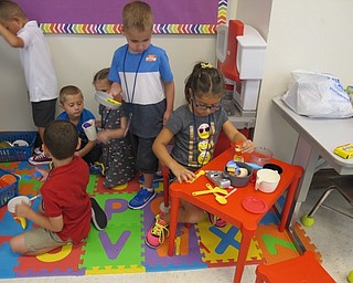 Neighbors | Alexis Bartolomucci.The kindergarten students in Maggie Schuster's class explored different stations on the first day of school at Poland Union Elementary on Aug. 22.