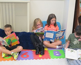 Neighbors | Alexis Bartolomucci.Kindergarten students read different books they picked out on the first day of school on Aug. 22 at Union Elementary in Maggie Schuster's class.