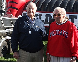 Nikos Frazier | The Vindicator..Brad Ramsbottom, 91, and Laddie Fedor, 92, talk with members of the media at the tailgate party celebrating the 100-year anniversary of the Struthers football program.