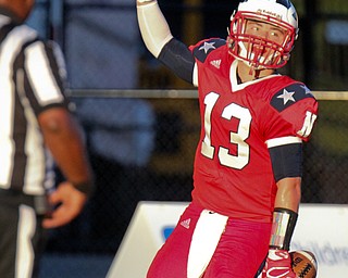 William D. Lewis/The Vindicator Niles Tyler Srbinovich(13) celebrates after scoring during Friday Sept. 2, 2016 game at Niles with Poland.