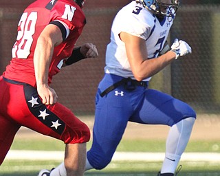 William D. Lewis/The Vindicator Poland'sJonah Spencer(3) eludes Niles' Robbie Savin during Sept 2, 2016 game at Niles.