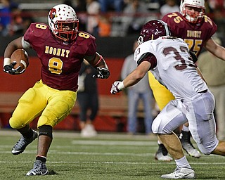 YOUNGSTOWN, OHIO - SEPTEMBER 2, 2016: Ray Anderson #8 of Mooney runs the football while linebacker Alex King breaks down to tackle him during the second half of their game Friday night at Stambaugh Stadium. DAVID DERMER | THE VINDICATOR