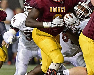 YOUNGSTOWN, OHIO - SEPTEMBER 2, 2016: Running back Jaylen Hewlett #9 of Mooney runs the football into the end zone to score after running past Gaven Strines #34 and Evan Walton #61 of Boardman during the second half of their game Friday night at Stambaugh Stadium. DAVID DERMER | THE VINDICATOR
