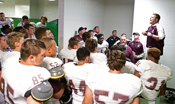YOUNGSTOWN, OHIO - SEPTEMBER 2, 2016: Boardman head coach Joe Ignazio speaks to his team in the locker room following their 28-26 victory over Cardinal Mooney at Stambaugh Stadium. DAVID DERMER | THE VINDICATOR