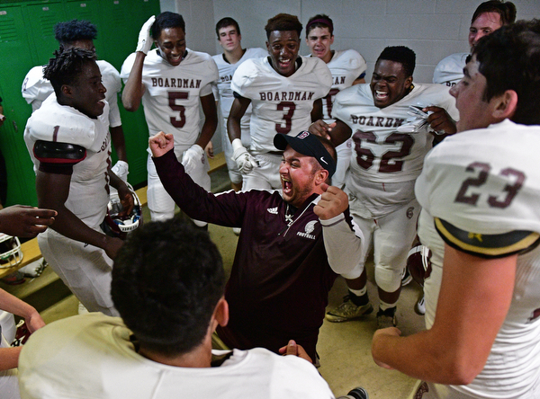 YOUNGSTOWN, OHIO - SEPTEMBER 2, 2016: Boardman assistant coach Ryan Holmes celebrates in the locker room following their 28-26 victory over Cardinal Mooney at Stambaugh Stadium. DAVID DERMER | THE VINDICATOR