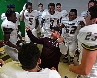 YOUNGSTOWN, OHIO - SEPTEMBER 2, 2016: Boardman assistant coach Ryan Holmes celebrates in the locker room following their 28-26 victory over Cardinal Mooney at Stambaugh Stadium. DAVID DERMER | THE VINDICATOR