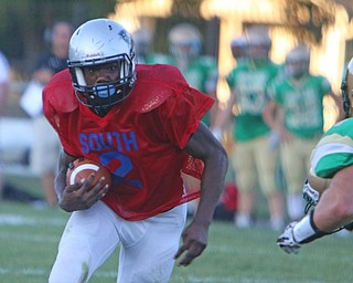Youngstown East's Michael Lawrence (2) runs to the outside beating an Ursuline defender to the corner during the first quarter of Friday nights matchup at Rayen Field in Youngstown. Dustin Livesay  |  The Vindicator  9/2/16  Rayen Stadium