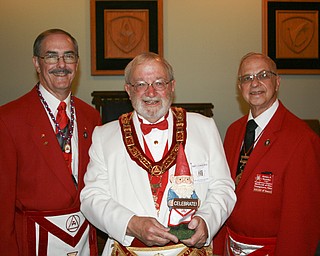 SPECIAL TO THE VINDICATOR
Grand Officers of the Grand Chapter of Royal Arch Masons, Ohio, visited Canfield Aug. 21 to dedicate the new meeting place of Youngstown Chapter 93, Royal Arch Masons. The Youngstown chapter has been meeting for 150 years and moved to a new site at the Argus Masonic Temple on Shields Road in Canfield when the Youngstown temple closed in June. From left, are Richard J. Brady, high priest of the Youngstown chapter; Robert D. Blankerhorn, grand high priest of Ohio; and James A. Streeky, district deputy grand high priest of this Masonic district.