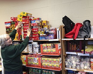 SPECIAL TO THE VINDICATOR
Kathy Wujcik, coordinator of Newton Falls Community Backpack Program, is shown in the storage/packing room at Newton Falls Middle School preparing for this year’s food program. The program provided 1,080 bags of food and 1,080 new and used books to local children in 2015-16. Donors include Newton Falls Kiwanis Club, Newton Falls Public Library, Friends of the Library, Church Mouse, First Baptist Church Vacation Bible School program, Ladies Guild of Sts. Mary and Joseph Church, First Christian Church, Newton Falls United Methodist Church and Associated School Employees Credit Union. Recipients are chosen by the elementary and middle schools and distribution is made from the school’s office. The project is used to supplement a child’s meals and snacks. A collection box can be found at ASECU, Newton Falls Branch, 25 S. Canal St., with grocery lists of items needed. Monetary donations also can be made at ASECU with your name or the group’s name in the memo line.