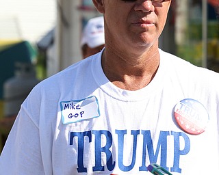 Nikos Frazier | The Vindicator..Mike Young of Berlin Center talks with a reporter outside the Mahoning County Democratic Party Tent at the Canfield Fair on Monday, Sept. 5, 2016.