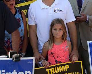 Nikos Frazier | The Vindicator..Ohio Rep. John Boccieri and his daughter, Leanna, 8, outside the Mahoning County Democratic Party Tent at the Canfield Fair on Monday, Sept. 5, 2016.