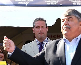 Nikos Frazier | The Vindicator..Rep. Tim Ryan watches Richard Trumka, AFL-CIO President, speak at a press conference outside the Mahoning County Democratic Party Tent at the Canfield Fair on Monday, Sept. 5, 2016.