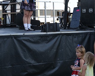 Nikos Frazier | The Vindicator..Jeanette Willis waves to two young fans after performing with her family at the Canfield Fair on Monday, Sept. 5, 2016.