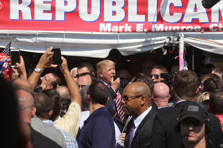  .          ROBERT  K. YOSAY | THE VINDICATOR..The Donald speaks briefly to crwod as he exittied...Donald Trump... visitedthe Canfield Fair on Monday afternoon..-30-