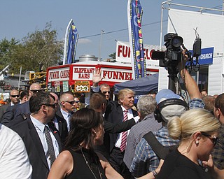  .          ROBERT  K. YOSAY | THE VINDICATOR..The Donald is surrounded by  security as he makes his way down the midway..crowds 7-9000 people   waited to see THE DONALD as he made his way to the Republican tent..Donald Trump... visitedthe Canfield Fair on Monday afternoon..-30-