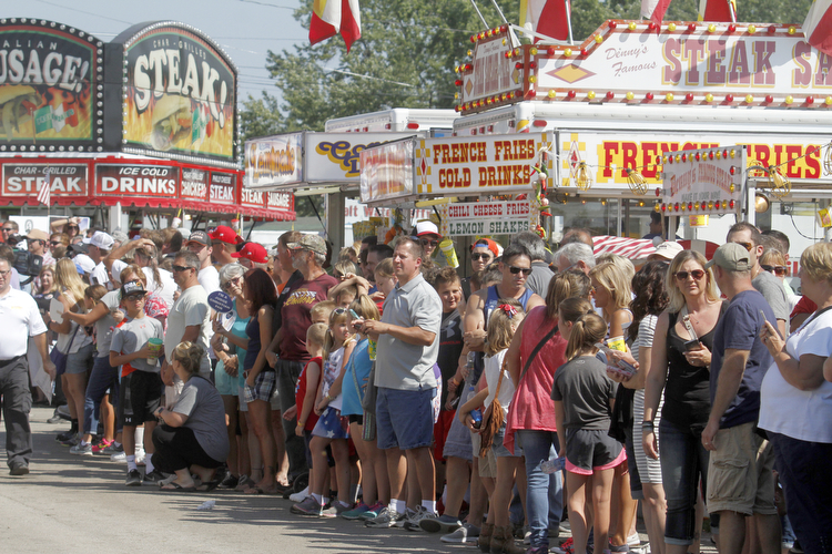  .          ROBERT  K. YOSAY | THE VINDICATOR..crowds 7-9000 people   waited to see THE DONALD as he made his way to the Republican tent..Donald Trump... visitedthe Canfield Fair on Monday afternoon..-30-