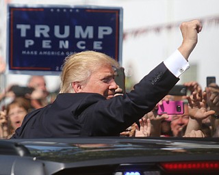  .          ROBERT  K. YOSAY | THE VINDICATOR..The Donald waves to the crowd as he leaves the fair..Donald Trump... visitedthe Canfield Fair on Monday afternoon..-30-