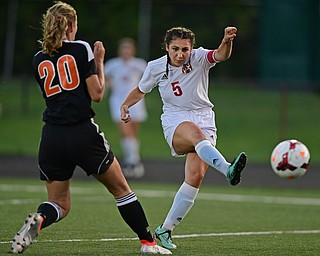 CANFIELD, OHIO - SEPTEMBER 7, 2016: Anita Mancini #5 of Canfield takes a shot on the goal after Alex Othman #20 of Howland did not cover her in time, she would score on the shot, in the first half of their game Wednesday night at Canfield High School. DAVID DERMER | THE VINDICATOR