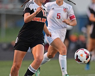 CANFIELD, OHIO - SEPTEMBER 7, 2016: Caleigh Hogan #13 of Howland kicks the ball away from Anita Mancini #5 of Canfield in the first half of their game Wednesday night at Canfield High School. DAVID DERMER | THE VINDICATOR