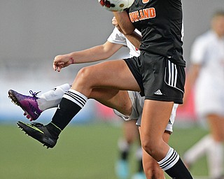 CANFIELD, OHIO - SEPTEMBER 7, 2016: Sara Ciletti #9 of Howland leaps to play the ball away from Alana Petracci #14 of Canfield in the first half of their game Wednesday night at Canfield High School. DAVID DERMER | THE VINDICATOR