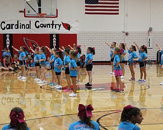Neighbors | Abby Slanker.The Canfield Little Cardinals 115 cheer squad performed a routine at the Canfield High School cheerleaders’ annual Kiddie Cheer Camp on Aug. 10.