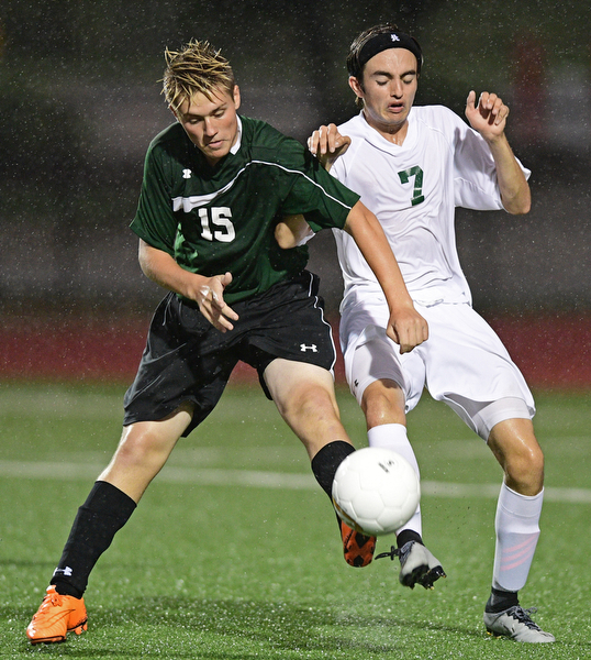 YOUNGSTOWN, OHIO - SEPTEMBER 8, 2016: Johnny Rowland #15 of West Branch and Nick Beike #7 of Ursuline battle for the loose ball at midfield during the second half of their game Thursday night at Youngstown State University. DAVID DERMER | THE VINDICATOR