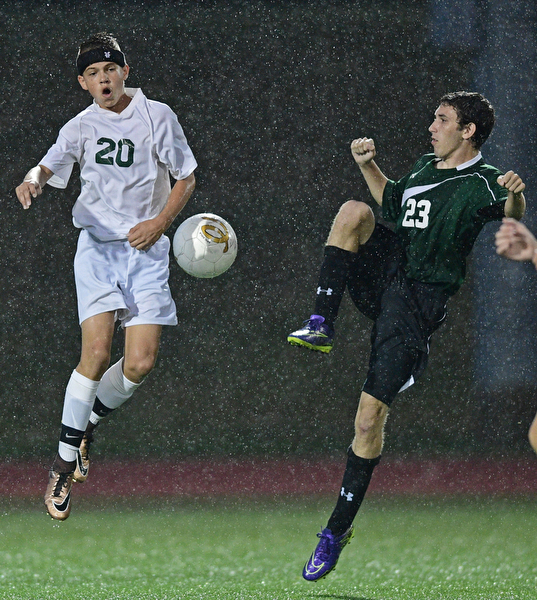 YOUNGSTOWN, OHIO - SEPTEMBER 8, 2016: Jacob Coman #20 of Ursuline leaps in the air to attempt to deflect the ball away from Andy Stainer #23 of West Branch during the second half of their game Thursday night at Youngstown State University. DAVID DERMER | THE VINDICATOR