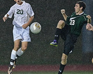 YOUNGSTOWN, OHIO - SEPTEMBER 8, 2016: Jacob Coman #20 of Ursuline leaps in the air to attempt to deflect the ball away from Andy Stainer #23 of West Branch during the second half of their game Thursday night at Youngstown State University. DAVID DERMER | THE VINDICATOR