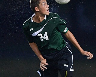 YOUNGSTOWN, OHIO - SEPTEMBER 8, 2016: Connor Hedrick #24 of Ursuline heads the ball after a goalie kick during the second half of their game Thursday night at Youngstown State University. DAVID DERMER | THE VINDICATOR