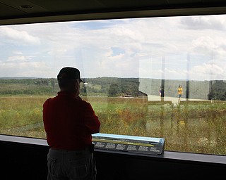 Nikos Frazier | The Vindicator..Clark Guy of Sommerset Pa. looks out the observation window at the Flight 93 National Memorial Visitor Center in Shanksville, Pa.Nikos Frazier | The Vindicator..