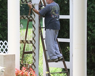        ROBERT K. YOSAY  | THE VINDICATOR..Sam Swogger  event Co ordinator...and the thirdGasearch volunteers gather ed friday  8/26  to paint and spruce up the 9/11 Memorial in Memorial Park for upcoming Sept. 11 ceremony in Austintown.. - -30-...