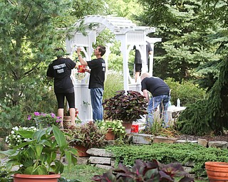        ROBERT K. YOSAY  | THE VINDICATOR.. Kelly Bartolec, senior marketing coordinator, and  Eric Wright and Wayne Ensor - Gasearch volunteers gather ed friday  8/26  to paint and spruce up the 9/11 Memorial in Memorial Park for upcoming Sept. 11 ceremony in Austintown.. - -30-...