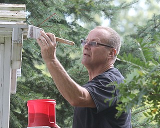        ROBERT K. YOSAY  | THE VINDICATOR..Eric Schiffhauer paints the top of a trellis.... Gasearch volunteers gather ed friday  8/26  to paint and spruce up the 9/11 Memorial in Memorial Park for upcoming Sept. 11 ceremony in Austintown.. - -30-...