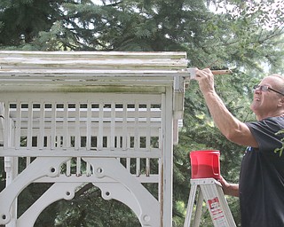        ROBERT K. YOSAY  | THE VINDICATOR..Eric Schiffhauer paints the top of a trellis.... Gasearch volunteers gather ed friday  8/26  to paint and spruce up the 9/11 Memorial in Memorial Park for upcoming Sept. 11 ceremony in Austintown.. - -30-...
