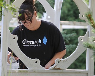        ROBERT K. YOSAY  | THE VINDICATOR.. Kelly Bartolec, senior marketing coordinator, and  Gasearch volunteers gather ed friday  8/26  to paint and spruce up the 9/11 Memorial in Memorial Park for upcoming Sept. 11 ceremony in Austintown.. - -30-...