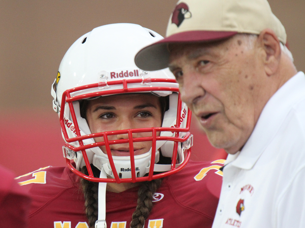 William D Lewis The Vindicator Mooney kicker Lizzie Philibin is the school's first female football player. She is shown talking with former coach Don Bucci.