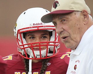 William D Lewis The Vindicator Mooney kicker Lizzie Philibin is the school's first female football player. She is shown talking with former coach Don Bucci.