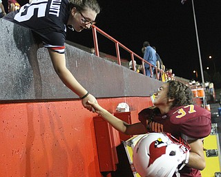 William D Lewis The Vindicator Mooney kicker Lizzie Philibin (37)  Mooneys first female player, shakes hand with her frind and fellow Mooney student Lauren Markovich duringSept. 9, 2016 game against Akron North in Youngstown.i