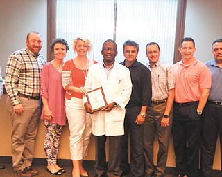 SPECIAL TO THE VINDICATOR
The Eastern Regional Kidney Foundation recently presented a plaque to the Kidney Group in recognition of its Diamond Sponsorship to fund grants the foundation gives local patients. Members of the ERKF and Kidney Group present for the award included Dr. Michael Koprucki, left, Dr. Patrick Martinucci, Dr. Kathleen Padgitt, ERKF President of the Board Meghan Hiland,  Dr. Nathaniel Doe, Dr. Hasit Pandya, Dr. Sherif Soliman, Dr. Christopher Enoch and Dr. Anup Bains. Drs. Andra Shaer and Leonidas Vassilaros also are foundation members. The foundation is a non-profit organization with the mission to support local renal and kidney transplant patients with transportation and medication grants, and to raise awareness and education in the community about kidney disease. The foundation is not associated with the American Kidney Foundation or any government agency, and receives money only from community contributions. It is hosting its sixth annual Kidney Awareness Run/Walk and Renal Family Picnic at 9 a.m. Sept. 25 at the Canfield Fairgrounds. There will be a 50-50 drawing, basket auction, prizes, a free continental breakfast during registration and a free lunch following the walk/run. Donations are tax-deductible. Registration is $25. For information on sponsorship or registration, go to www.erkidney.org or call 888-674-7313.