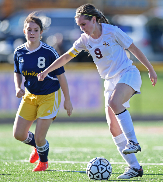 CANFIELD, OHIO - SEPTEMBER 12, 2016: Casey Windstorm #9 of South Range gains control of the ball after getting behind defender Katlyn Phillips #8 of United during the first half of their game Monday night at South Range High School. DAVID DERMER | THE VINDICATOR