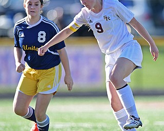 CANFIELD, OHIO - SEPTEMBER 12, 2016: Casey Windstorm #9 of South Range gains control of the ball after getting behind defender Katlyn Phillips #8 of United during the first half of their game Monday night at South Range High School. DAVID DERMER | THE VINDICATOR