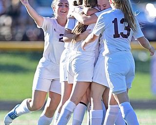 CANFIELD, OHIO - SEPTEMBER 12, 2016: Casey Windstorm #9 of South Range is hugged by her teammates Caragyn Yanek #10, Lillian Kimpel #3, Jillian Maynard and Abbey Bokros #13 during the first half of their game Monday night at South Range High School. DAVID DERMER | THE VINDICATOR.