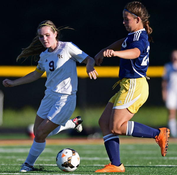 CANFIELD, OHIO - SEPTEMBER 12, 2016: Casey Windstorm #9 of South Range battles for the ball with Paige Irwin #20 of United during the second half of their game Monday night at South Range High School. DAVID DERMER | THE VINDICATOR.