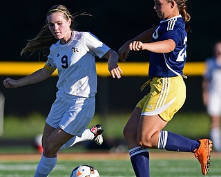 CANFIELD, OHIO - SEPTEMBER 12, 2016: Casey Windstorm #9 of South Range battles for the ball with Paige Irwin #20 of United during the second half of their game Monday night at South Range High School. DAVID DERMER | THE VINDICATOR.
