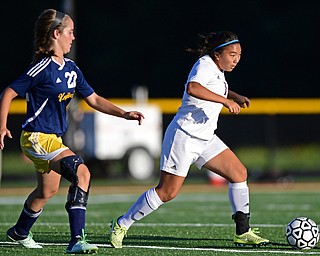 CANFIELD, OHIO - SEPTEMBER 12, 2016: Marie DePascale #1 of South Range dribbles the ball away from Molly Briceland #22 of United during the second half of their game Monday night at South Range High School. DAVID DERMER | THE VINDICATOR.