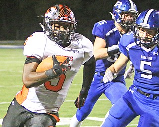Howland runningback Tyriq Ellis (5) outruns Poland's Tony Chiaro (5) to the sidelines giving him an open lane to the endzone during the third quarter of Friday nights matchup at Poland High School.   Dustin Livesay  |  The Vindicator  9/16/16  Poland Seminary High School.