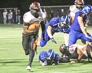 Howland's tyriq Ellis (5) cuts through a hole in the Bulldog defense to find an open lane to the endzone up the sidelines during the third quarter of Friday nights matchup at Poland High School.   Dustin Livesay  |  The Vindicator  9/16/16  Poland Seminary High School.