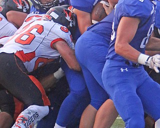 Poland High School quarterback Cole Kosco (16) gets pushed over the endzone line by a group of Bulldogs through the Howland defense during the first quarter of Friday nights matchup at Poland High School.   Dustin Livesay  |  The Vindicator  9/16/16  Poland Seminary High School.
