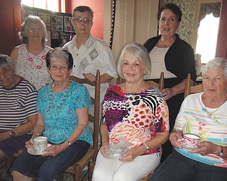SPECIAL TO THE VINDICATOR
Girard Historical Society members are preparing for a tea at 2 p.m. Oct. 1 at the Barnhisel House, 1011 N. State St. Above, seated from left, are Joan Twaddle, Colette Chuey, Sally Curl and Shirley Hunter, and standing are Ginnie Derhammer, Margie Walker and Mary Anne Creatore. The cost is $12 for adults and $6 for children. There will be music, a basket raffle and door prizes. Prizes also will be awarded for the best hats. For information and tickets, call 330-652-9838.