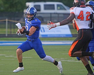 Poland's Reid Gould (2) cuts around the corner after getting a block on Howland's Chris Julian (42) during the first quarter of Friday nights matchup at Poland High School.   Dustin Livesay  |  The Vindicator  9/16/16  Poland Seminary High School.